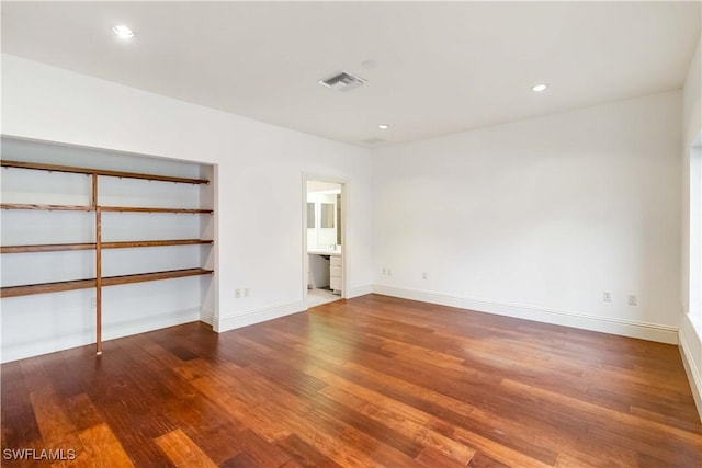 empty room featuring hardwood / wood-style flooring