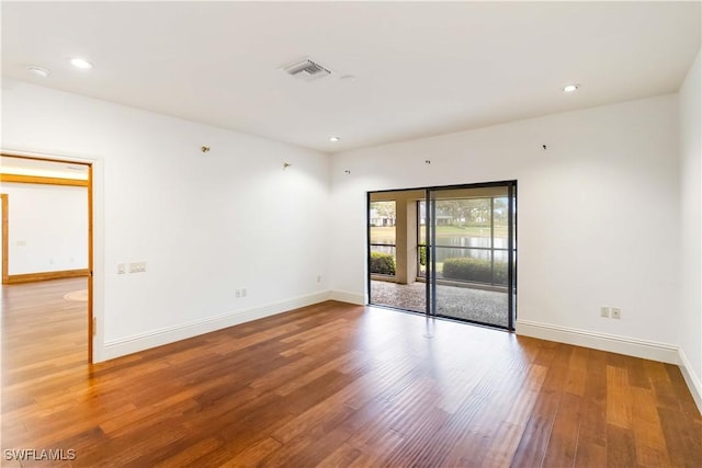 empty room featuring hardwood / wood-style flooring