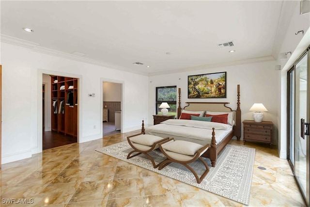 bedroom with crown molding, a spacious closet, and a closet