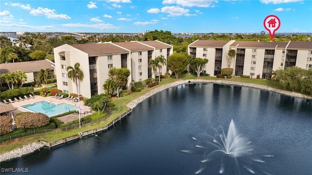 view of pool featuring a water view