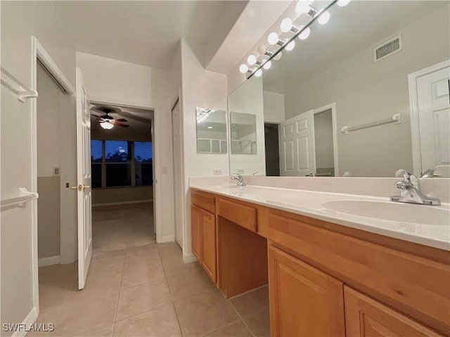 bathroom featuring ceiling fan, vanity, and tile patterned flooring