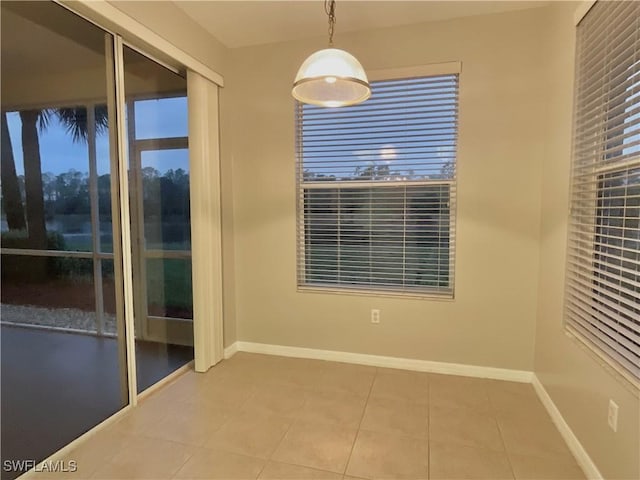 unfurnished room with light tile patterned floors