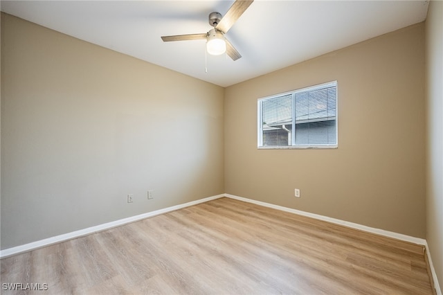 spare room with light hardwood / wood-style flooring and ceiling fan