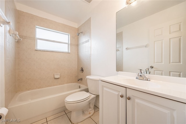 full bathroom featuring toilet, tiled shower / bath, tile patterned floors, and vanity