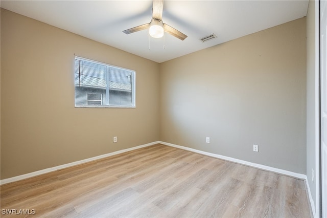 spare room with light hardwood / wood-style floors and ceiling fan