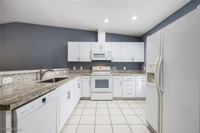 kitchen with sink, white appliances, white cabinets, and vaulted ceiling