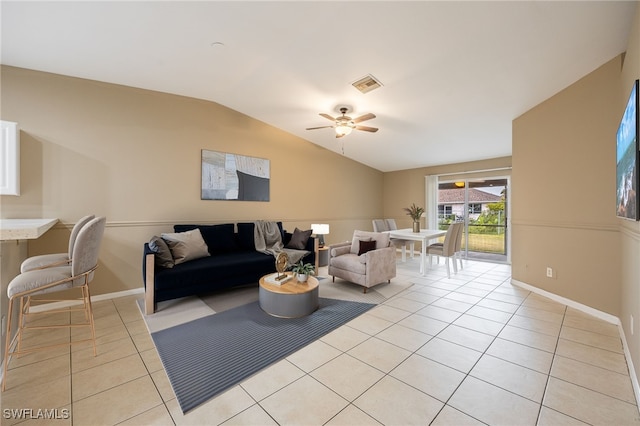 tiled living room with ceiling fan and lofted ceiling