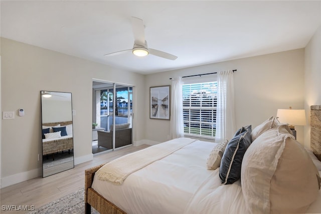 bedroom with ceiling fan, light hardwood / wood-style floors, and access to outside