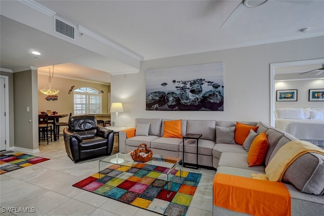 tiled living room with ceiling fan and ornamental molding