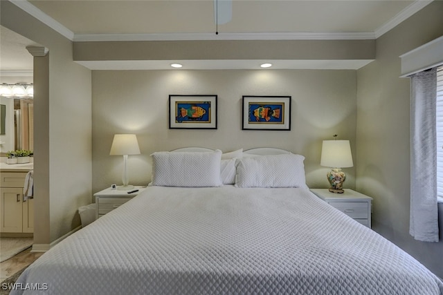 bedroom with ornamental molding and ensuite bathroom