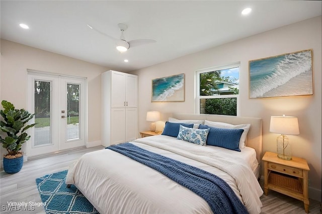 bedroom with light wood finished floors, recessed lighting, access to exterior, and french doors