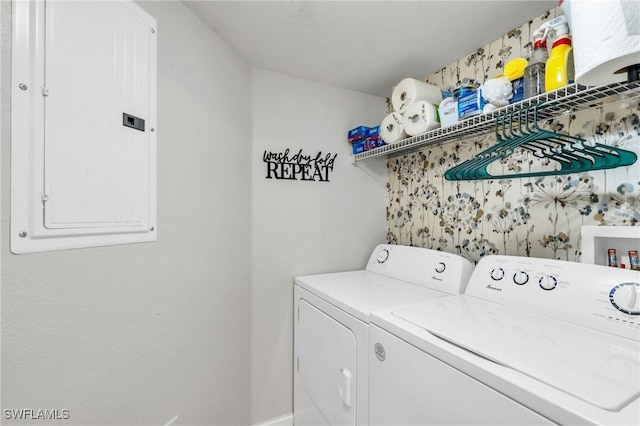 washroom featuring washing machine and dryer and electric panel