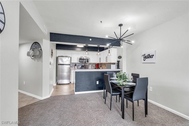 tiled dining area with an inviting chandelier