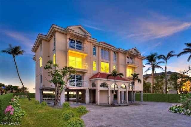 view of outdoor building at dusk