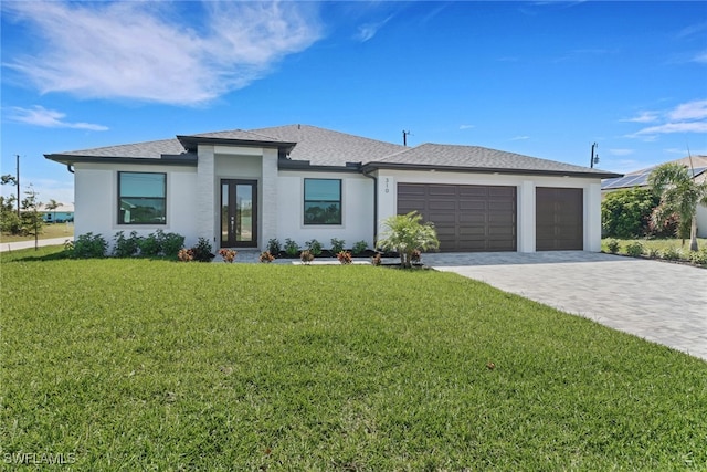 view of front facade featuring a shingled roof, a front lawn, stucco siding, decorative driveway, and a garage