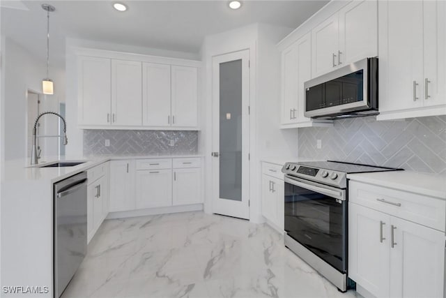 kitchen with white cabinets, marble finish floor, appliances with stainless steel finishes, and a sink