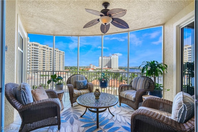 sunroom / solarium with ceiling fan