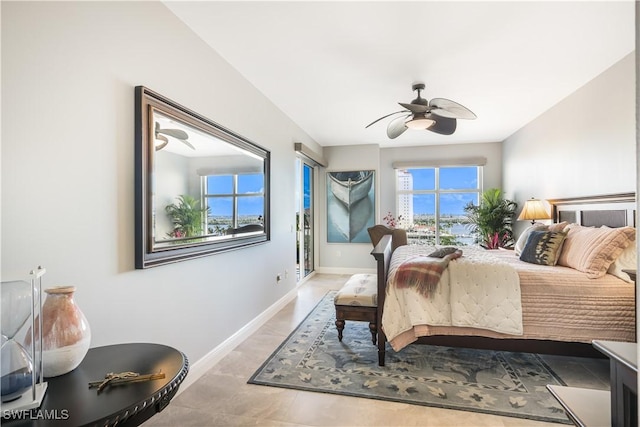 bedroom with ceiling fan and multiple windows