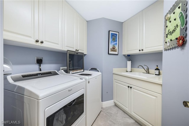 laundry room with light tile patterned floors, sink, separate washer and dryer, and cabinets