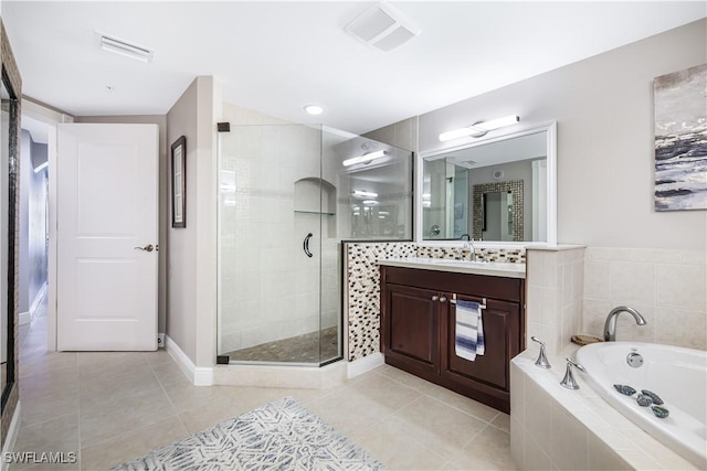 bathroom with vanity, tile patterned flooring, and shower with separate bathtub