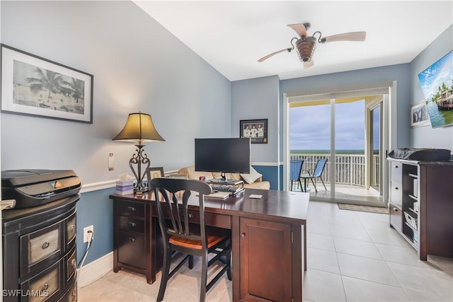 office space featuring ceiling fan and light tile patterned floors