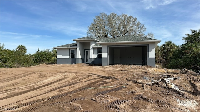 prairie-style house featuring a garage