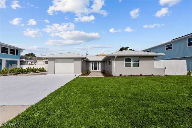 view of front facade featuring a garage and a front yard