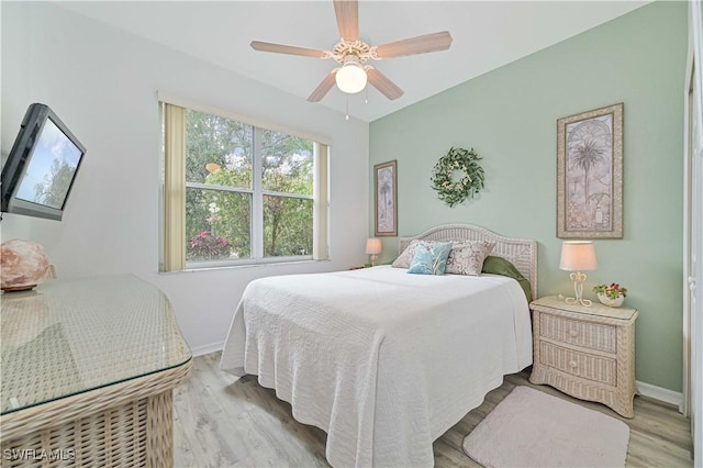 bedroom featuring ceiling fan and light hardwood / wood-style flooring