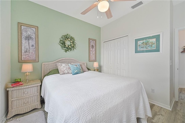 bedroom featuring ceiling fan, a closet, and light hardwood / wood-style flooring