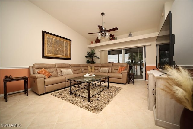 living room with ceiling fan, vaulted ceiling, and light tile patterned flooring