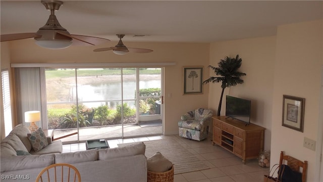 living room with ceiling fan and light tile patterned floors