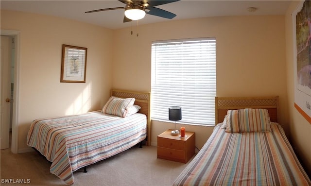 bedroom with ceiling fan and light colored carpet