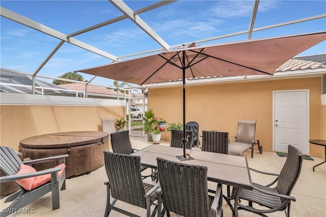 view of patio featuring a lanai and outdoor dining space