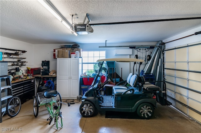 garage with a garage door opener and a wall mounted air conditioner