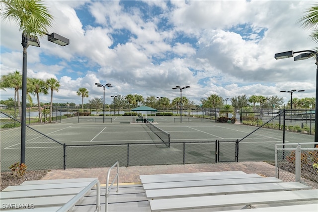 view of tennis court with fence