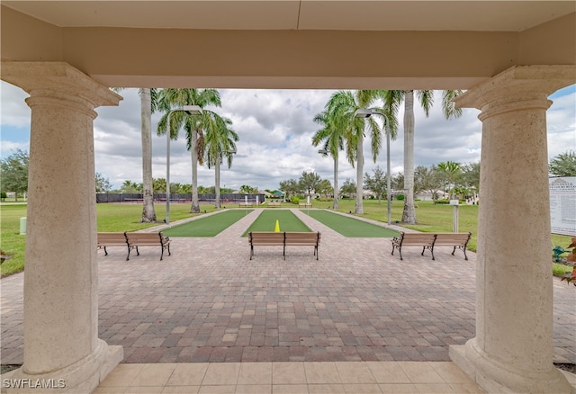 view of property's community with a lawn