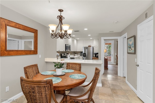 dining room featuring recessed lighting, visible vents, baseboards, and an inviting chandelier