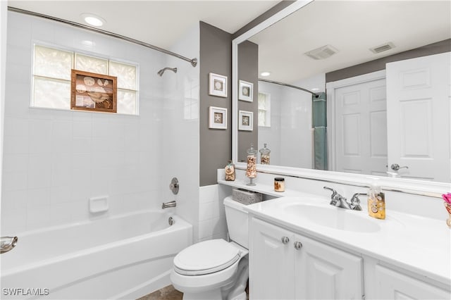 full bath with shower / bath combination, visible vents, toilet, and vanity