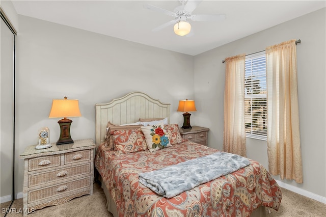 bedroom featuring a closet, carpet flooring, a ceiling fan, and baseboards