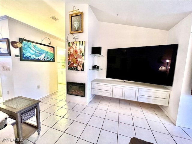 tiled living room featuring lofted ceiling