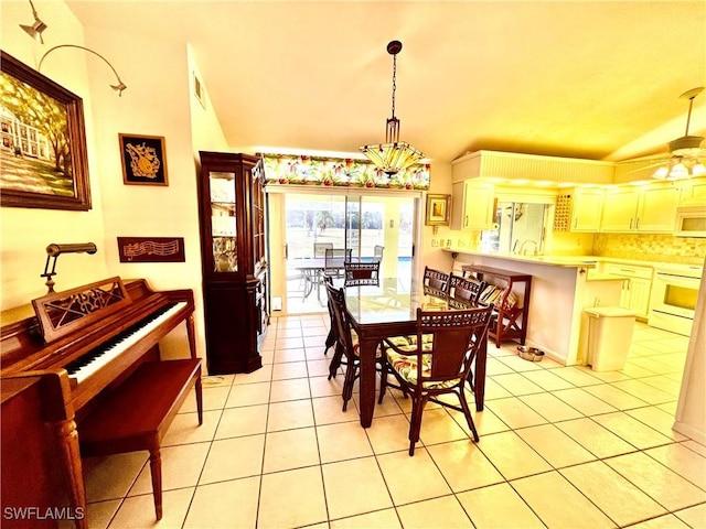 dining room with ceiling fan and light tile patterned flooring