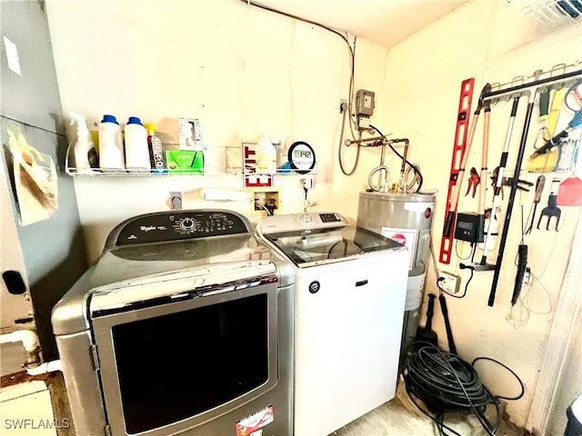 laundry area with separate washer and dryer and electric water heater