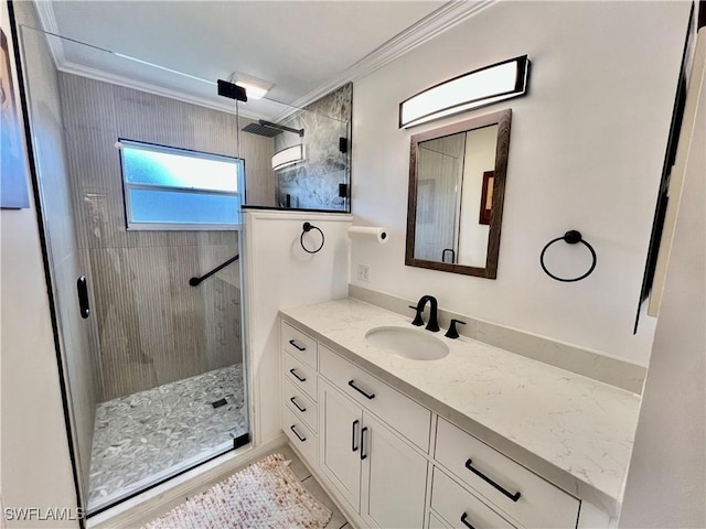 bathroom featuring vanity, walk in shower, and ornamental molding