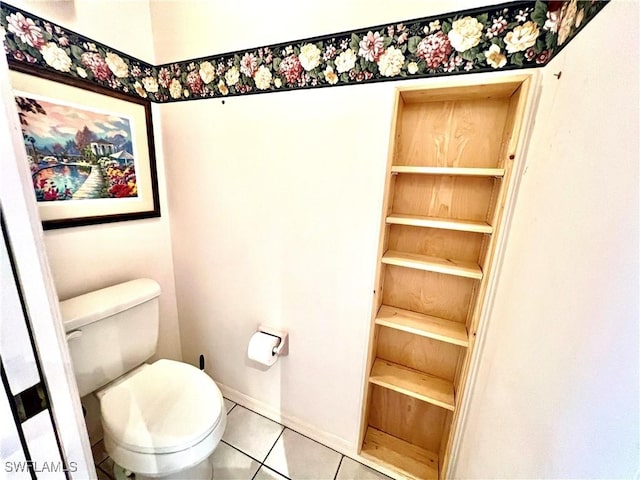 bathroom featuring toilet and tile patterned floors