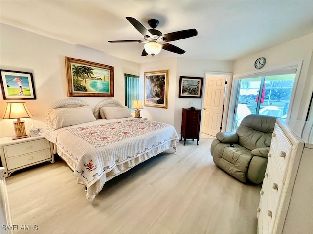 bedroom with ceiling fan and light hardwood / wood-style floors