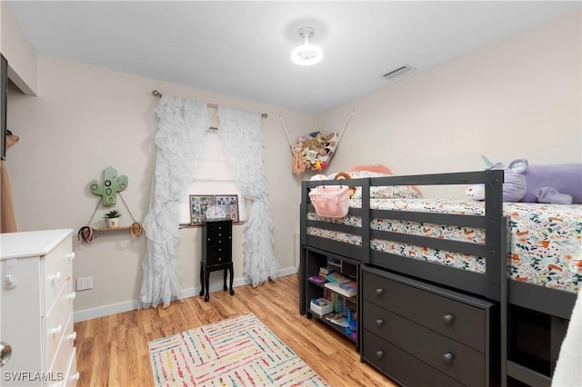 bedroom with light hardwood / wood-style flooring