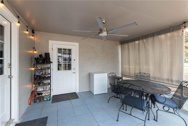 view of patio featuring ceiling fan