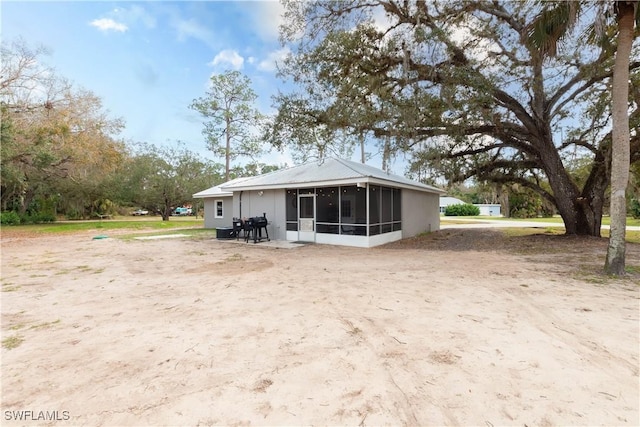 rear view of house with a sunroom