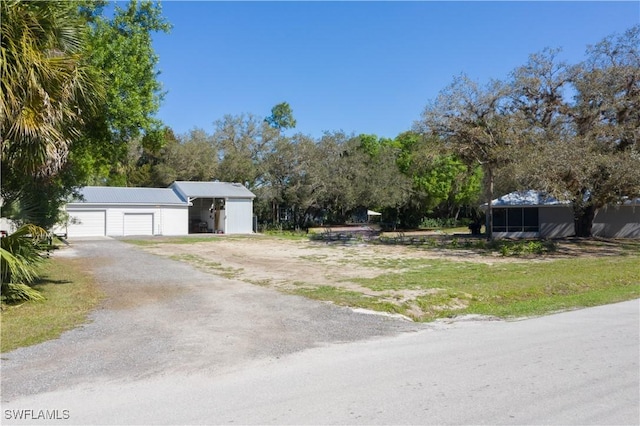 view of front facade with a detached garage