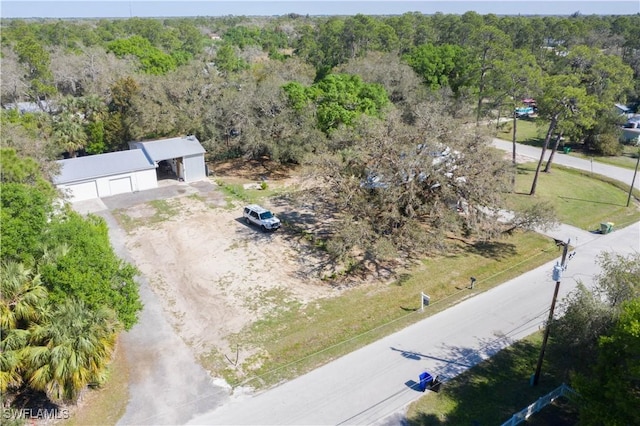 drone / aerial view with a view of trees